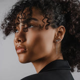 Model wearing the Trio Diamond Earring Chain, a silver earring chain featuring three sparkling cubic zirconia stones.