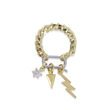 The Lightning Spear Can Opener Ring which is a bold gold-tone ring, features a chunky chain band with a unique silver accent bar and three dangling charms: a sparkling star, a textured spear, and a striking lightning bolt, combining edgy style with playful functionality.