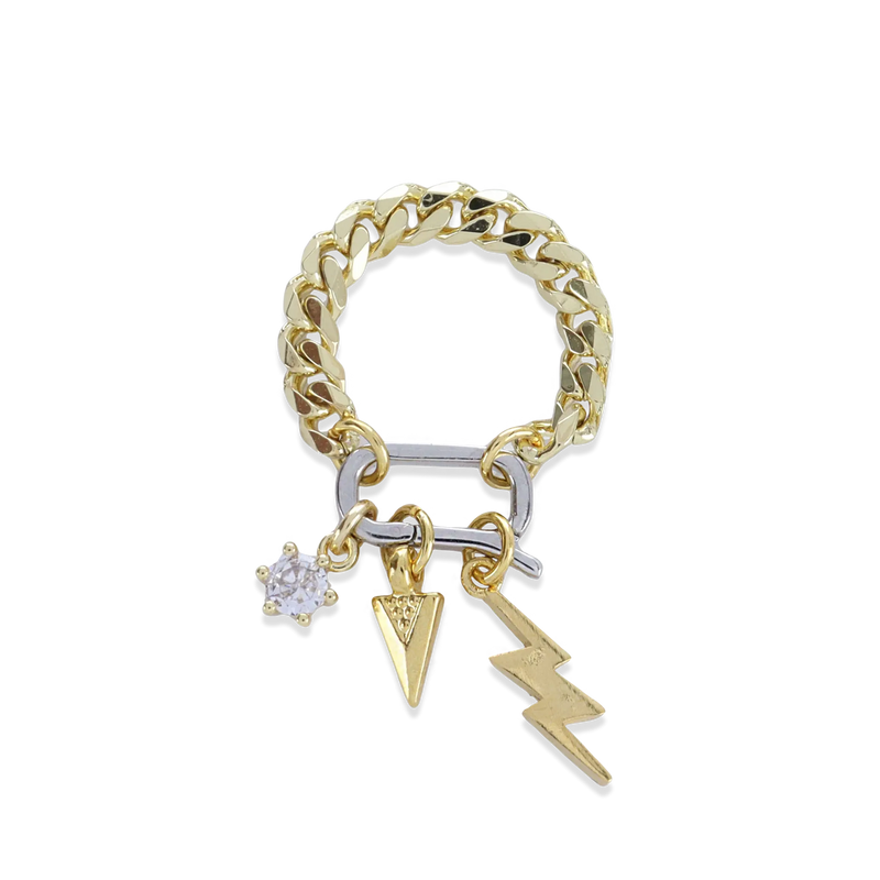 The Lightning Spear Can Opener Ring which is a bold gold-tone ring, features a chunky chain band with a unique silver accent bar and three dangling charms: a sparkling star, a textured spear, and a striking lightning bolt, combining edgy style with playful functionality.