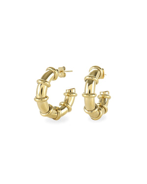 The Ringed-Up Bagel Hoops, a stunning pair of gold hoop earrings featuring a distinctive segmented design inspired by the shape of a bagel. 