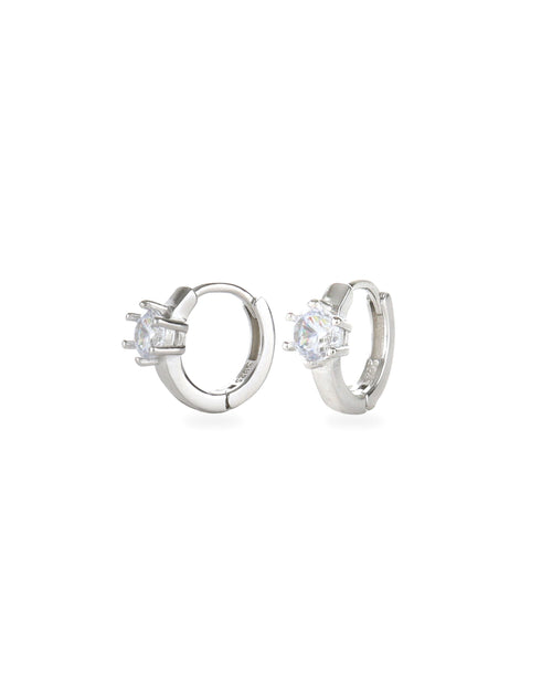 The Forever Piercing Hoops, a pair of sleek silver hoop earrings each adorned with a single prong-set crystal. 