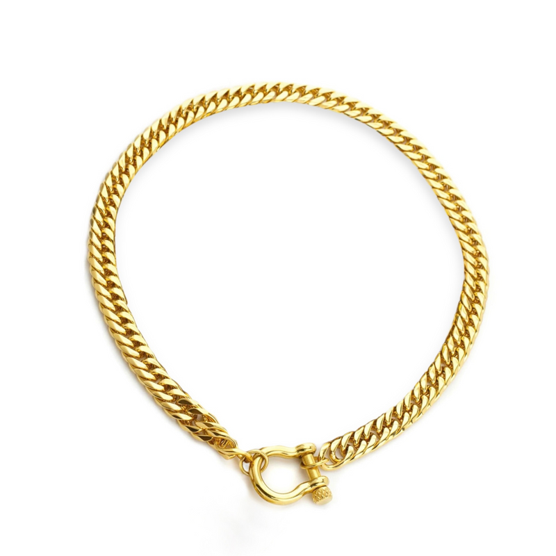 The Herradura Tropicana Necklace, a gold cuban link chain necklace with a unique horseshoe clasp.