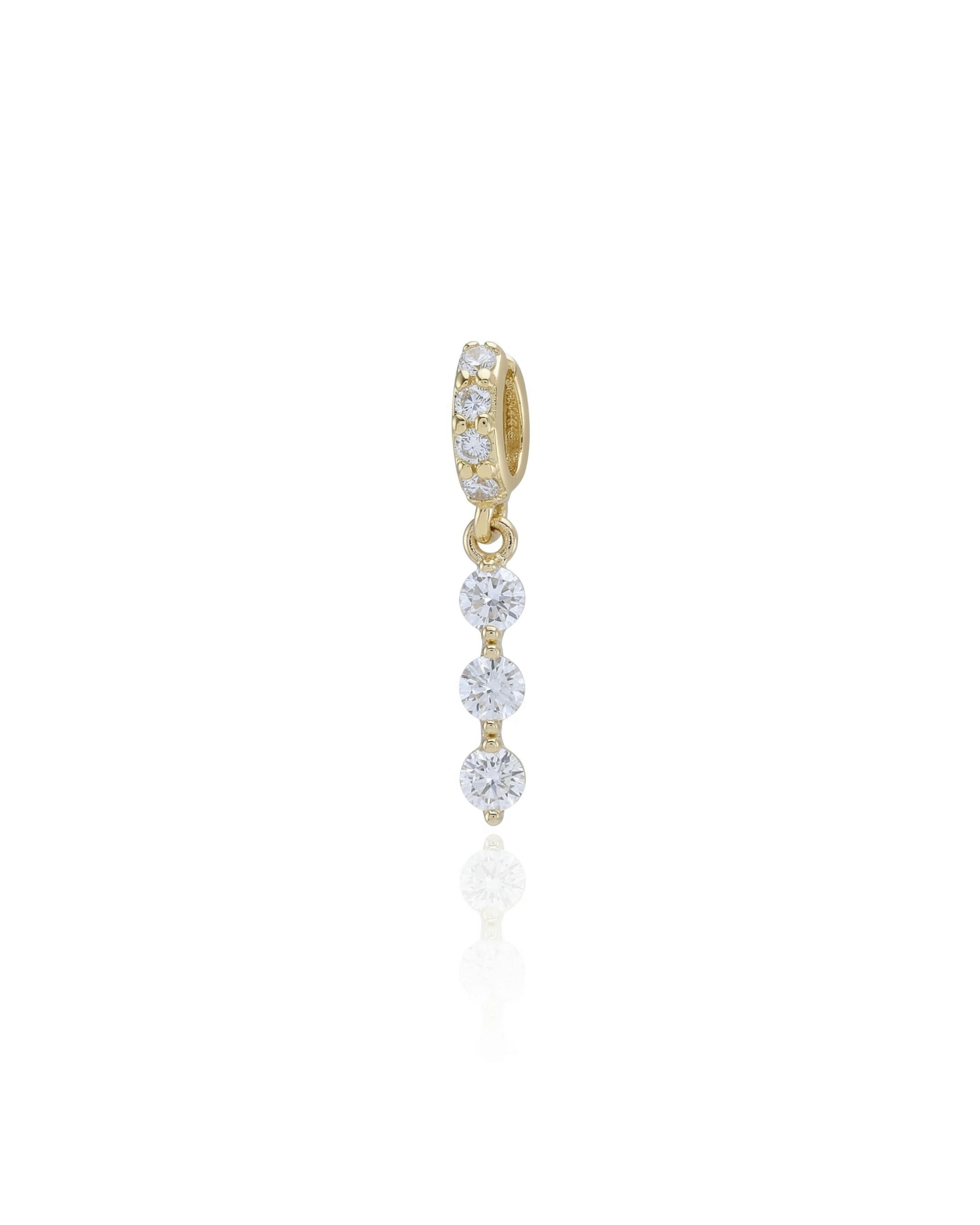 The TEARS OF GLIMMER CHARM with three cascading drop zirconias and gold diamond filled link.