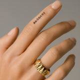 Model's hand wearing a Gold-plated Stainless Steel Accordion Ring with Geometric Pattern
