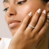 Model wearing the Diamond Band Ring, a silver ring featuring five dazzling brilliant-cut diamonds.
