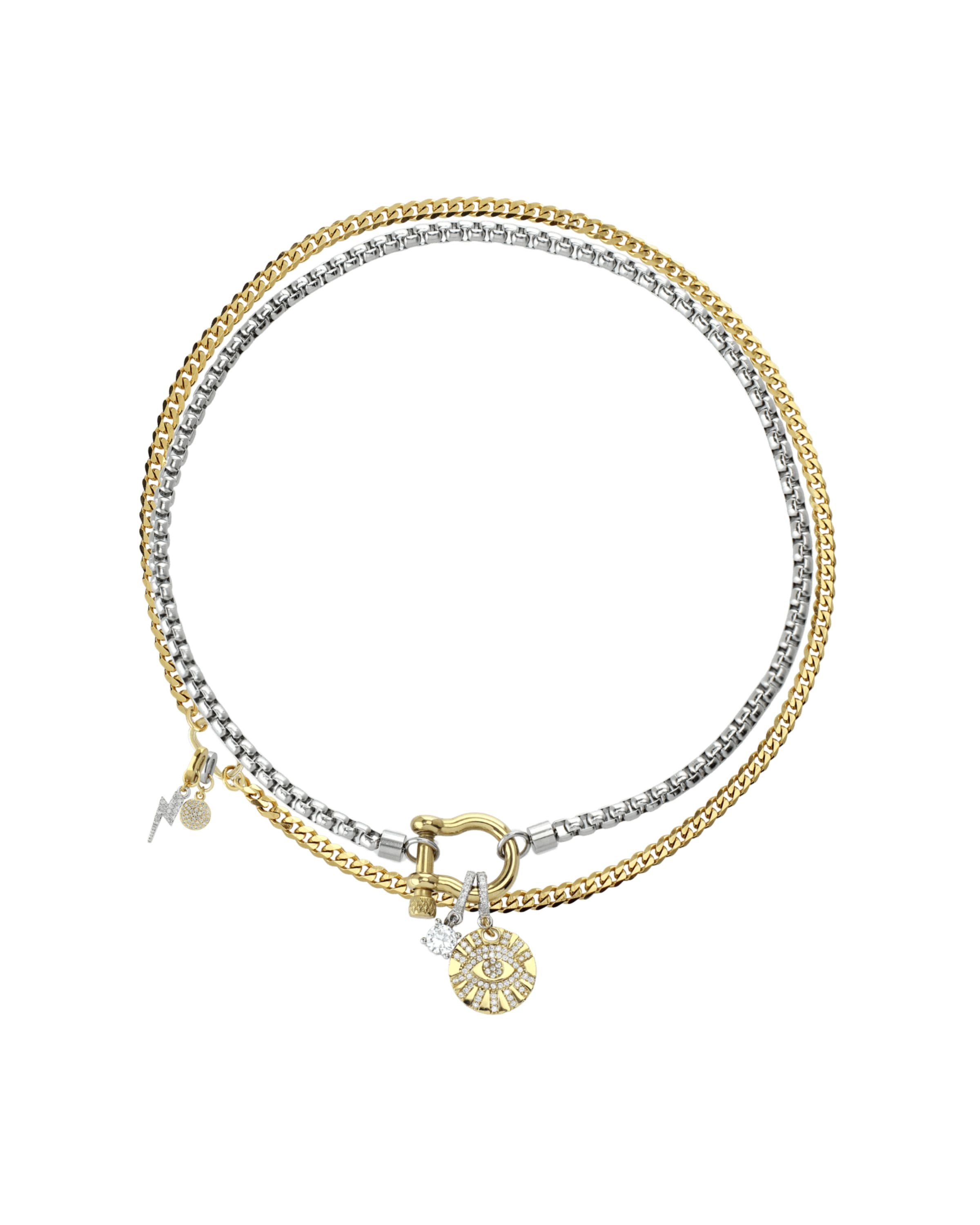 The Herradura Clip On Evil Eye Necklace Set, a two-piece silver and gold necklace set featuring a box chain and a Cuban chain with a gold horseshoe clasp, an evil eye charm, and a lightning bolt charm, all accented with diamond-like stones.