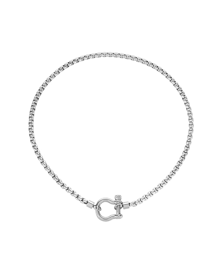 The Herradura Necklace, a silver chain featuring a signature horseshoe clasp with a cubic zirconia accent. ||| SILVER