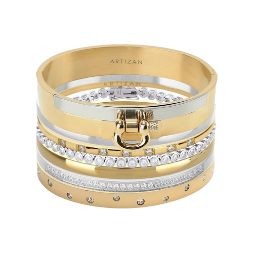 The ICONIC BRACELET STACK which is a stack of 7 gold and silver bracelets, including designs with crystal accents and a gold bracelet featuring a bold buckle clasp.