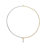 The CHARMED OPPOSITES NECKLACE, a two-tone necklace with half gold and half silver chain, featuring a small Lightning charm hanging from the center. ||| 
 Lightning Charm/MIX