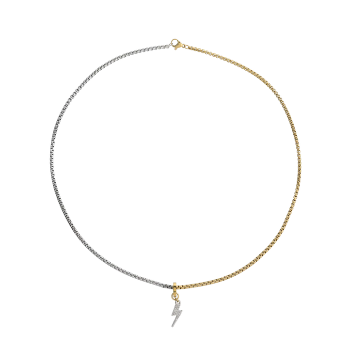 The CHARMED OPPOSITES NECKLACE, a two-tone necklace with half gold and half silver chain, featuring a small Lightning charm hanging from the center. ||| 
 Lightning Charm/MIX