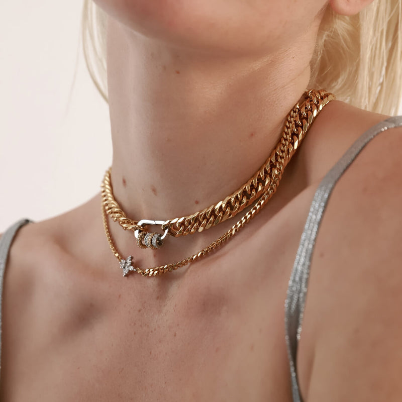 Model wearing the FUSION IRIS NECKLACE is made 18k gold plated cuban chain connected with a Sterling Silver lotus shaped zirconia charm.  She is also wearing the JUST CLICK PAVE CHAIN Necklace.