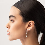 Model wearing the Butterfly Drop Earrings, elegant silver-tone earrings featuring sparkling butterfly-inspired designs with delicate dangling chains.