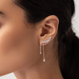 Model wearing the Butterfly Drop Earrings, elegant silver-tone earrings featuring sparkling butterfly-inspired designs with delicate dangling chains.