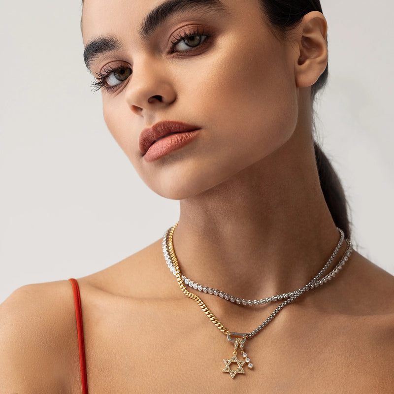 Model wearing the bubble tennis necklace and the can opener necklace featuring the TEARS OF GLIMMER CHARM with three cascading drop zirconias and gold diamond filled link and the DAVID’S STAR CLIP ON CHARM.