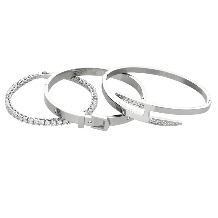 The **Core Stack**, a set of three sleek silver-tone bracelets, includes a sparkling stone bangle, a minimalist cuff, and a modern nail-inspired design, perfect for layering or wearing solo.