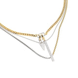 Can Opener Mix Pavé Layered Necklace Set, a mixed-metal layered necklace featuring gold and silver chains with pavé pendants attached to a signature carabiner clasp.