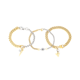 Chain Gang Bracelet Stack featuring three bracelets, a mix of gold and silver chains with triangle and star charms, accented with evil eye charm with sparkling rhinestones.