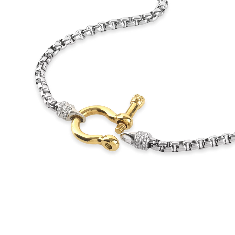 The Herradura Signature Pave Mix, a silver necklace featuring a box chain with a gold horseshoe clasp accented with pave-set diamond-like stones.