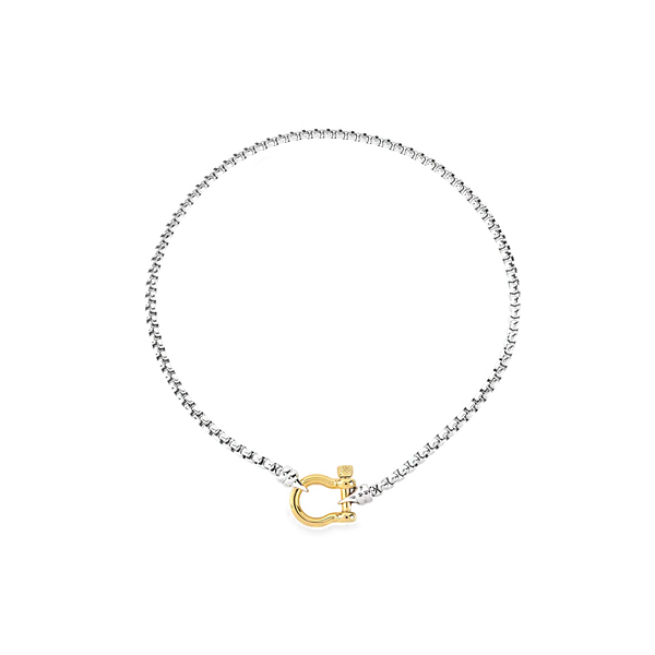 The Herradura Signature Mix, a silver necklace featuring a box chain with a gold horseshoe clasp.