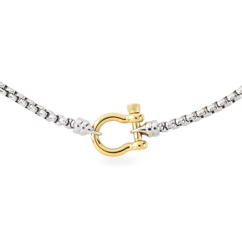 The Herradura Signature Mix, a silver necklace featuring a box chain with a gold horseshoe clasp.