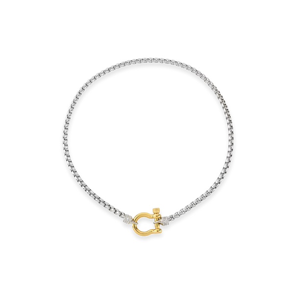 The Herradura Signature Pave Mix, a silver necklace featuring a box chain with a gold horseshoe clasp accented with pave-set diamond-like stones. |||Gold