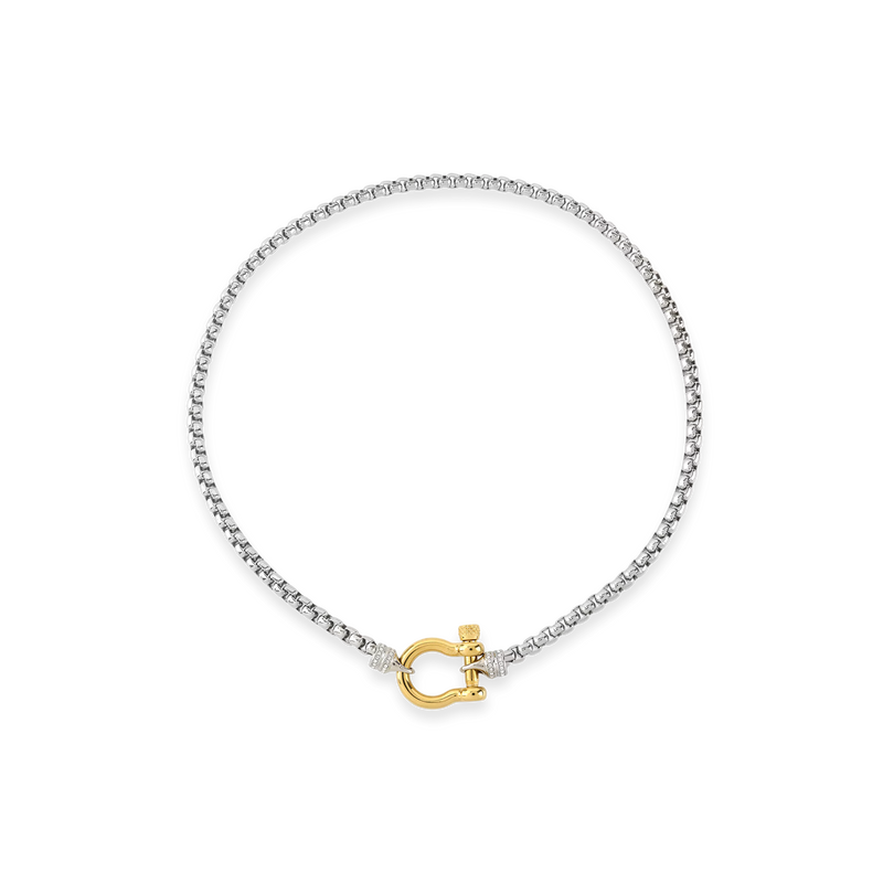 The Herradura Signature Pave Mix, a silver necklace featuring a box chain with a gold horseshoe clasp accented with pave-set diamond-like stones.