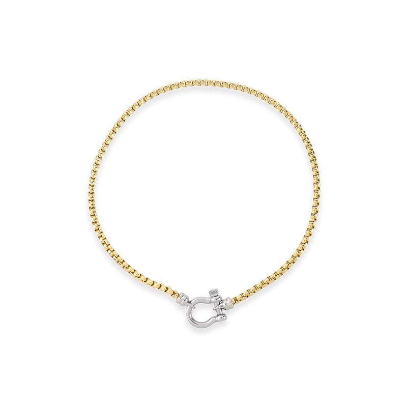 The Herradura Signature Mix, a gold necklace featuring a box chain with a silver horseshoe clasp.