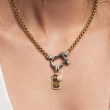The Herradura Signature Charm, which is a single-piece mixed metal necklace featuring a gold chain, silver clasp, and two detachable gold-tone charms embellished with pavé details. ||| SILVER