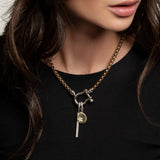 The Herradura Signature Double Take Silver, which is a bold mixed metal necklace featuring a chunky gold chain and silver clasp adorned with three distinct silver and gold charms. ||| SILVER