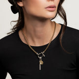 The Herradura Signature Double Take Silver, which is a bold mixed metal necklace featuring a chunky gold chain and silver clasp adorned with three distinct silver and gold charms. ||| SILVER