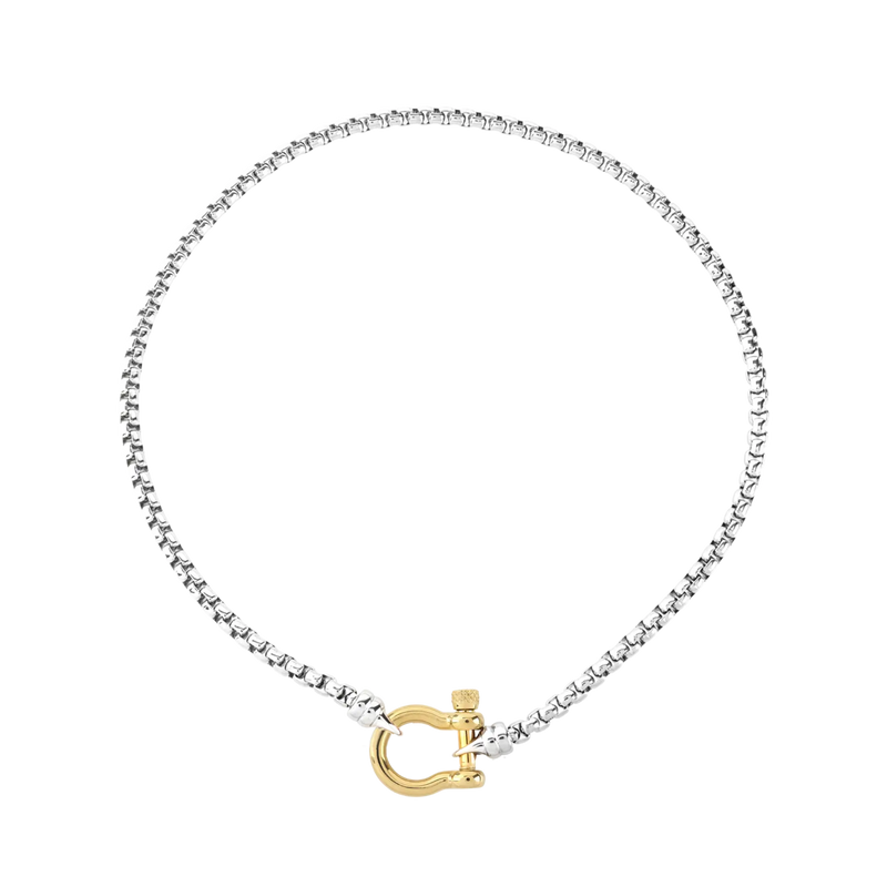 The Herradura Signature Mix, a silver necklace featuring a box chain with a gold horseshoe clasp. 
