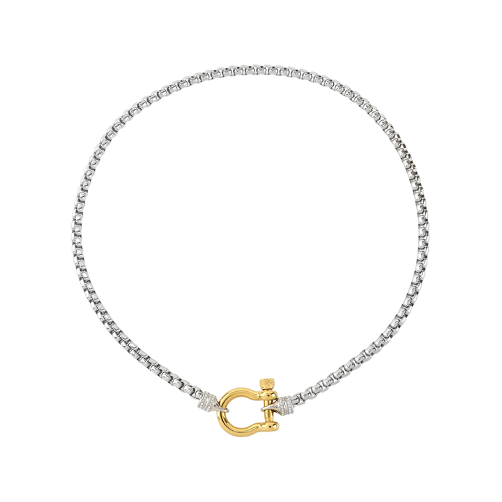 The Herradura Signature Pave Mix, a silver necklace featuring a box chain with a gold horseshoe clasp accented with pave-set diamond-like stones. |||Gold