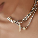 Silver bracelet stack featuring six sleek and bold designs, including chain, spike, and Herradura bangles.