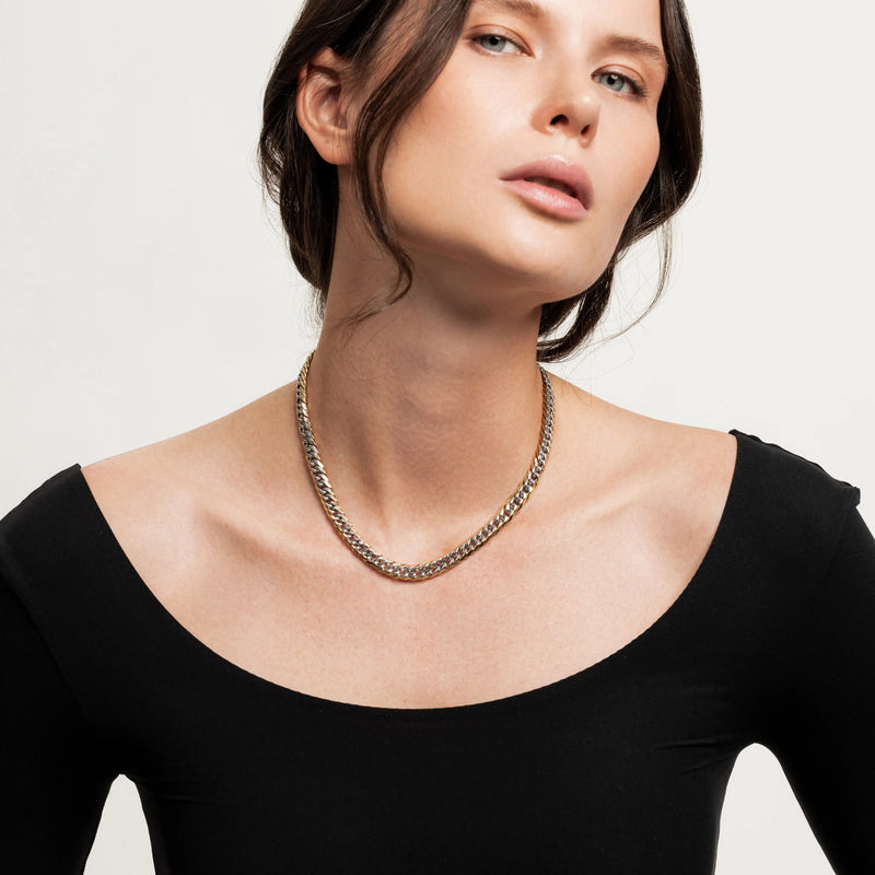 The Mix Chain Thin Necklace, which is a single-piece mixed metal chain necklace featuring interwoven gold and silver links in a sleek, close-fitting design.