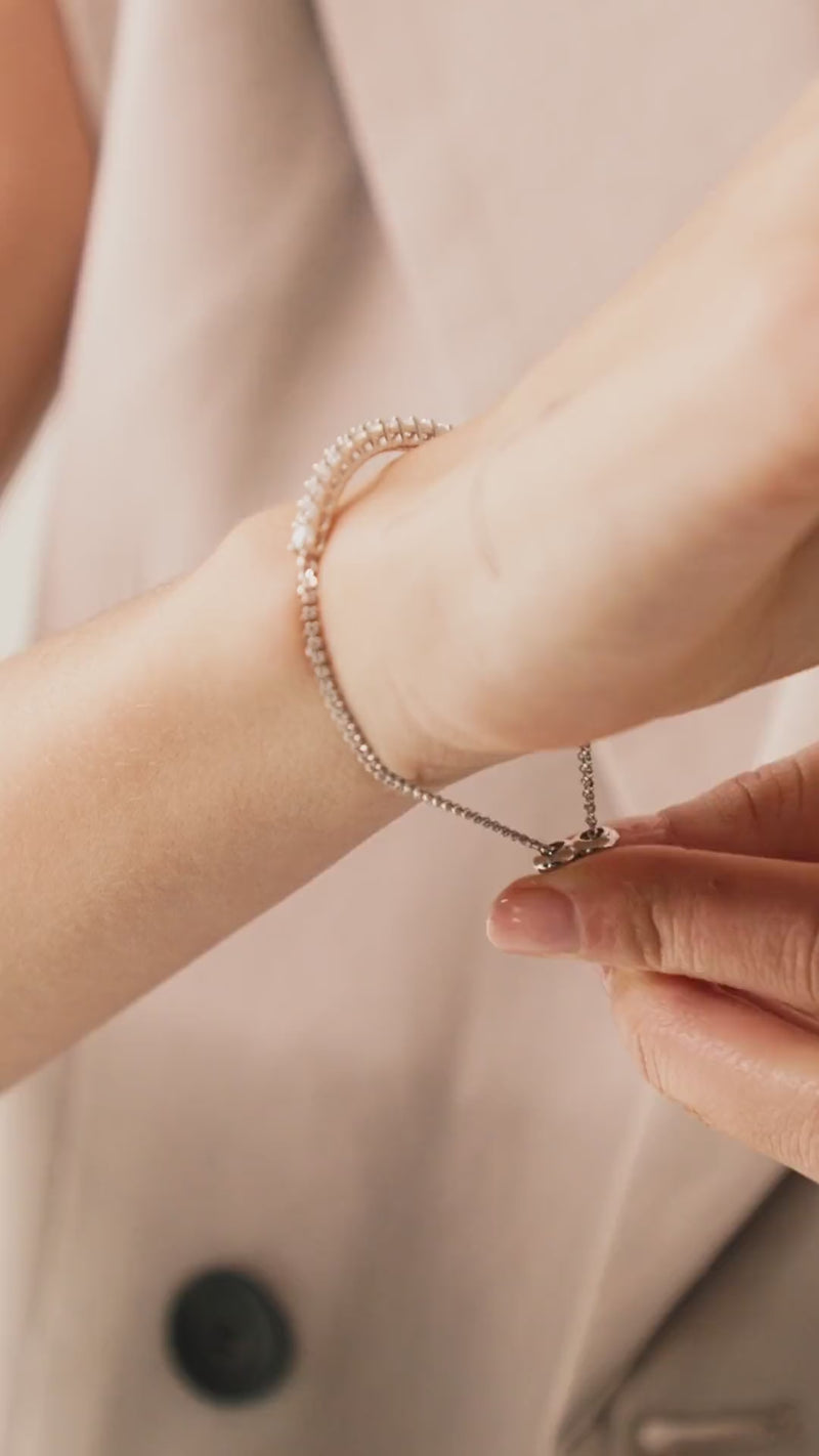 Video of a model putting on a Sparkling Diamond Tennis Bracelet with Adjustable Slider Closure