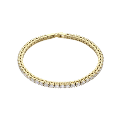 The ROUND CUT RIVIERE TENNIS BRACELET, which is a single gold bracelet with round-cut white stones in a bold prong setting. Not worn by a model. ||| GOLD