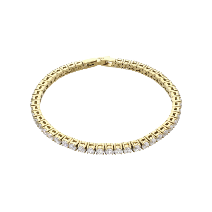 The ROUND CUT RIVIERE TENNIS BRACELET, which is a single gold bracelet with round-cut white stones in a bold prong setting. Not worn by a model. ||| GOLD