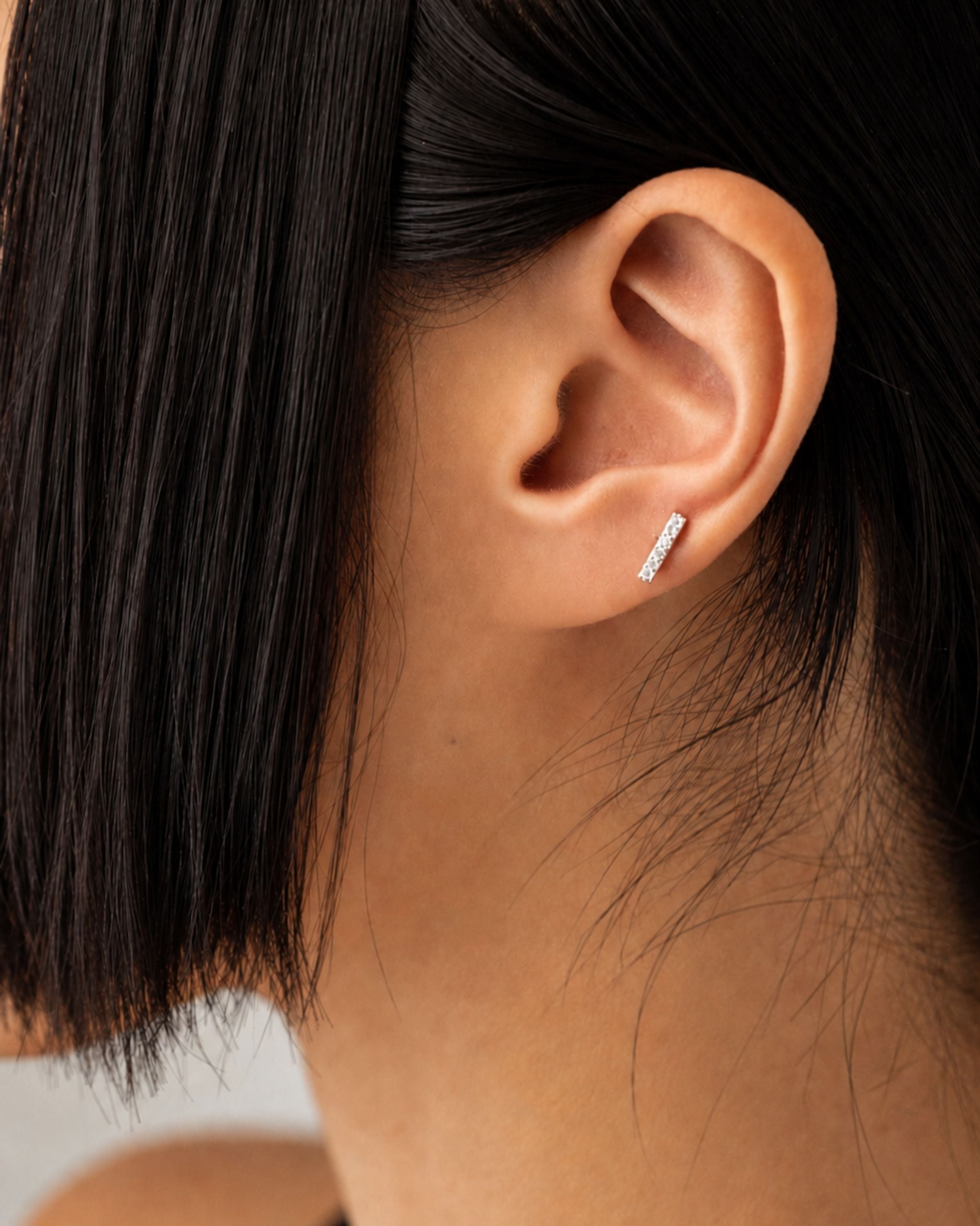 minimalist bar stud earring paved with small sparkling stones in cubic zirconia
