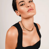 The TENNIS AND THE CURB CHAIN LAYERED NECKLACE SET which is a two-piece layered necklace stack featuring a gold curb chain and a silver tennis chain. ||| GOLD