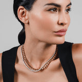 The TENNIS AND THE CURB CHAIN LAYERED NECKLACE SET which is a two-piece layered necklace stack featuring a gold curb chain and a silver tennis chain. ||| GOLD