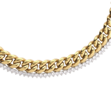 Close-up of The TENNIS AND THE CURB CHAIN LAYERED NECKLACE SET which is a two-piece layered necklace stack in gold, featuring a chunky curb chain and a diamond-accented tennis chain. ||| GOLD