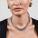 The TENNIS AND THE CURB CHAIN LAYERED NECKLACE SET which is a two-piece layered necklace stack in silver, featuring a curb chain and a tennis chain. ||| SILVER