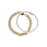 Close-up of The Bubble Curb Chain Bracelet Stack, a gold layered bracelet set featuring a chunky curb chain and a tennis bracelet with round-cut stones. ||| GOLD