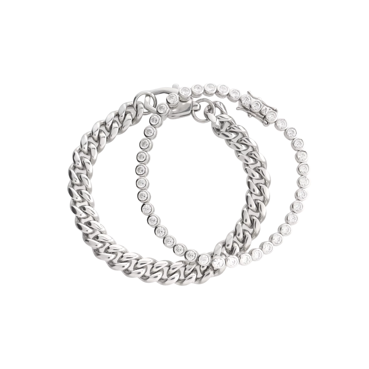 Close-up of The Bubble Curb Chain Bracelet Stack, a silver layered bracelet set featuring a chunky curb chain and a tennis bracelet with round-cut stones. ||| SILVER