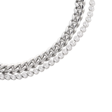 Close-up of The Bubble Curb Chain Bracelet Stack, a silver layered bracelet set featuring a chunky curb chain and a tennis bracelet with round-cut stones. ||| SILVER