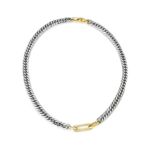 The Ischia Necklace, a single necklace featuring a chunky silver chain with a gold crystal-encrusted paperclip link accent. This mixed-metal design offers a modern and sophisticated look, blending silver and gold for a statement piece ideal for elevating any outfit.