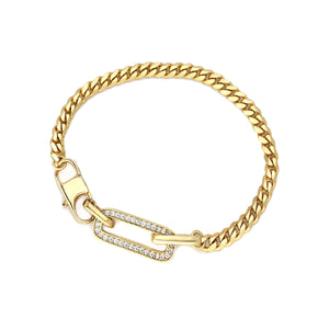 The Ischia Slim Bracelet, a single gold bracelet featuring a sleek curb chain with a crystal-studded paperclip link accent. This elegant and contemporary design adds a touch of sparkle and sophistication, ideal for layering or wearing solo to make a refined statement.