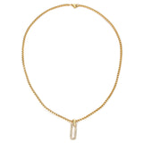 The Procida Necklace, which is a single-piece gold chain necklace, features a delicate box chain with a sparkling rectangular pendant, adding a touch of elegance and refined charm to any ensemble.