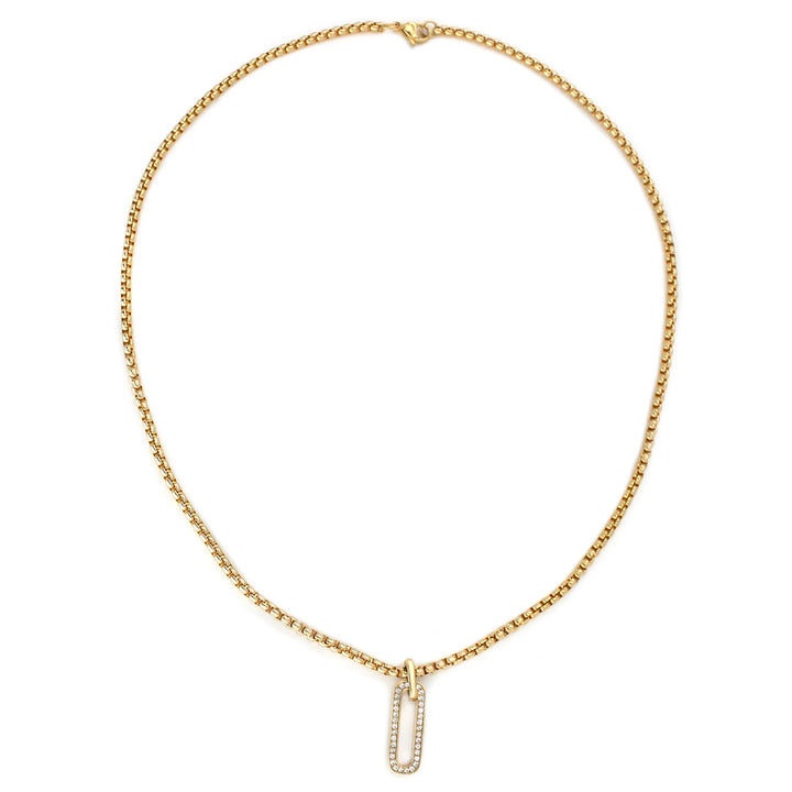 The Procida Necklace, which is a single-piece gold chain necklace, features a delicate box chain with a sparkling rectangular pendant, adding a touch of elegance and refined charm to any ensemble.
