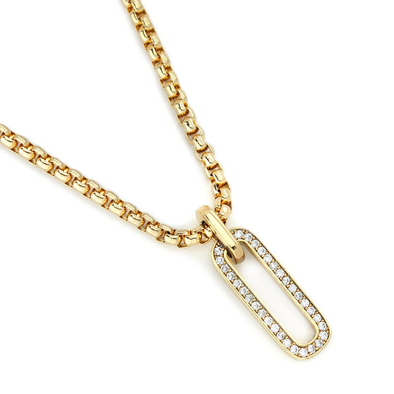 Oval shaped 18k gold plated and cubic zirconia charm and the gold chain of the Procida Necklace.